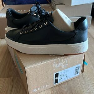 Kizik Vegas black and gold tennis shoes, new unworn with box